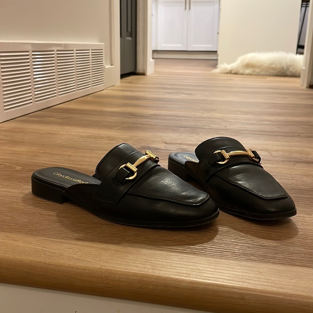 Black mules with gold accent